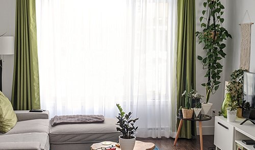 Green curtains in the living room Dubai